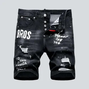 Black inscribed ripped denim shorts